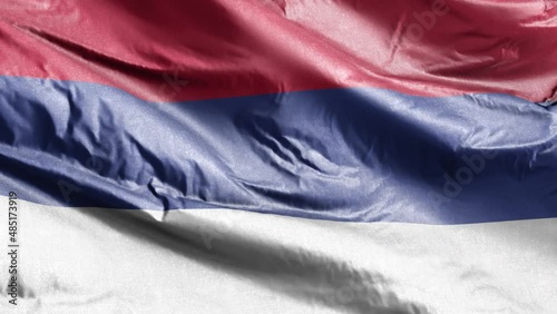 Srpska Republika textile flag waving on the wind loop. Srpska Republika banner swaying on the breeze. Fabric textile tissue. Full filling background. 10 seconds loop. photo