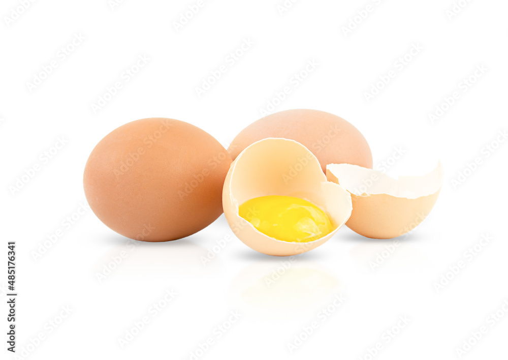 One broken egg and two whole eggs isolated on a white background One broken egg and two whole eggs isolated on a white background