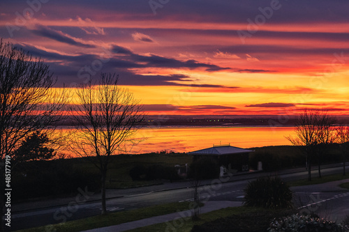 A fabulous golden sky reflecting into sandwich bay as seen from the Royal Esplanade in Ramsgate, February 2022.