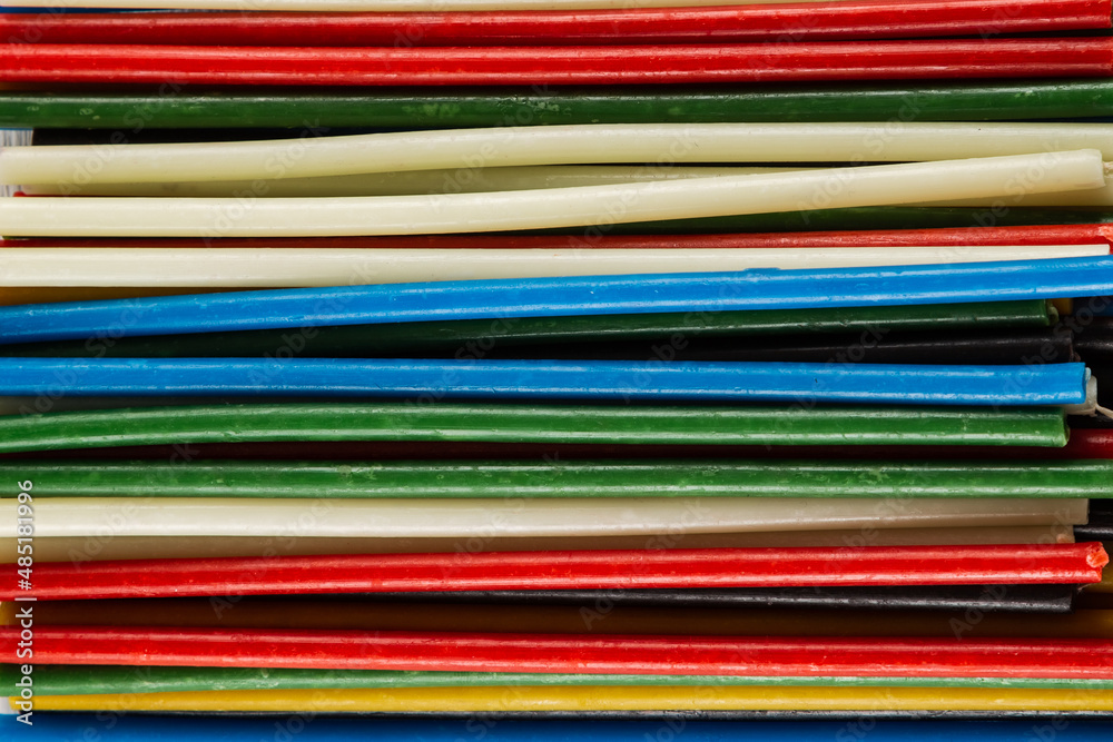 Multicolored candles close-up. Texture, background. Multicolored candles close-up. Texture, background.