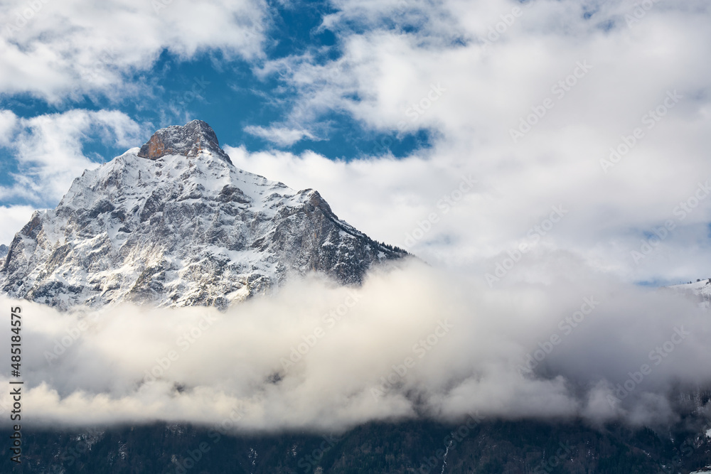 Switzerland, Fluelen.  Mountains covered with snow and clouds on the shores of Lake Lucerne in Switzerland in winter.