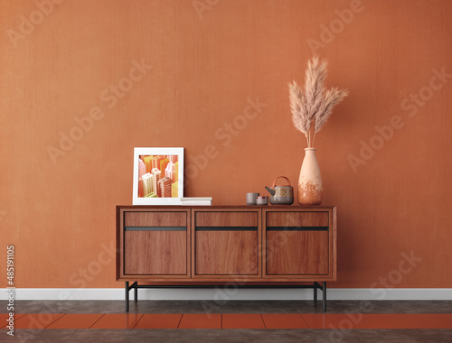 Wood table in the room with pampas,picture frame and orange wall background.3d rendering