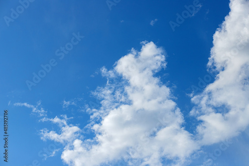 Beautiful blue clouds in the sky. Blue sky background.