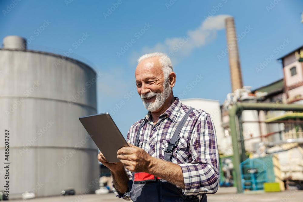 Factory worker using a tablet.