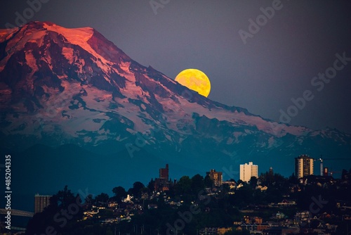 Moon rising over Mt Rainier viewed from Point Ruston in Tacoma Washington photo