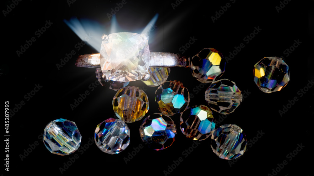 Diamonds and ring on black background Diamonds and ring on black background