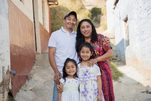 Hispanic family outside their house - Guatemalan family in the alley of their neighborhood