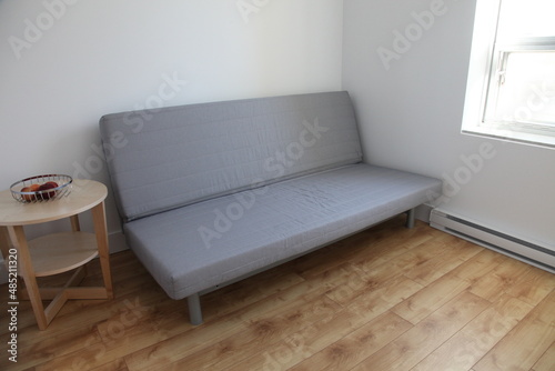 Stylish Scandinavian designed sofa bed, convertible in eight different stages (Phase 2) in modern apartment location.