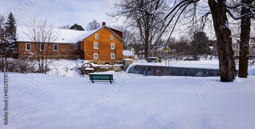 The village of Stanbrige-East, in the Eastern Townships, the old brick mill at the foot of the pike river almost completely frozen one day in February