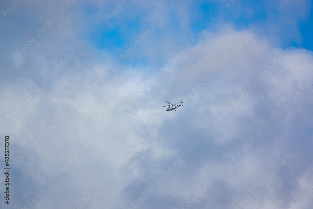 British army AgustaWestland AW159 Wildcat AH1 helicopter flying over Salisbury Plain (SPTA) UK cloudy blue sky British army AgustaWestland AW159 Wildcat AH1 helicopter flying over Salisbury Plain (SPTA) UK cloudy blue sky