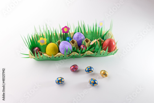simple craft from paper and decorated egg holder, DIY instructions, recycling concept photo