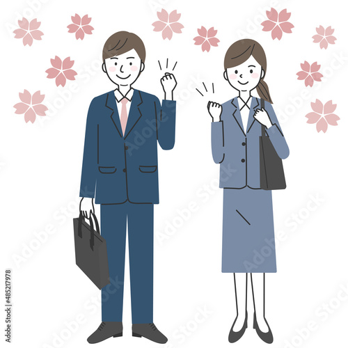 ガッツポーズをするスーツを着た会社員