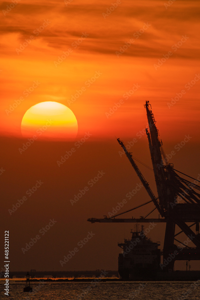 sunset and container crane
