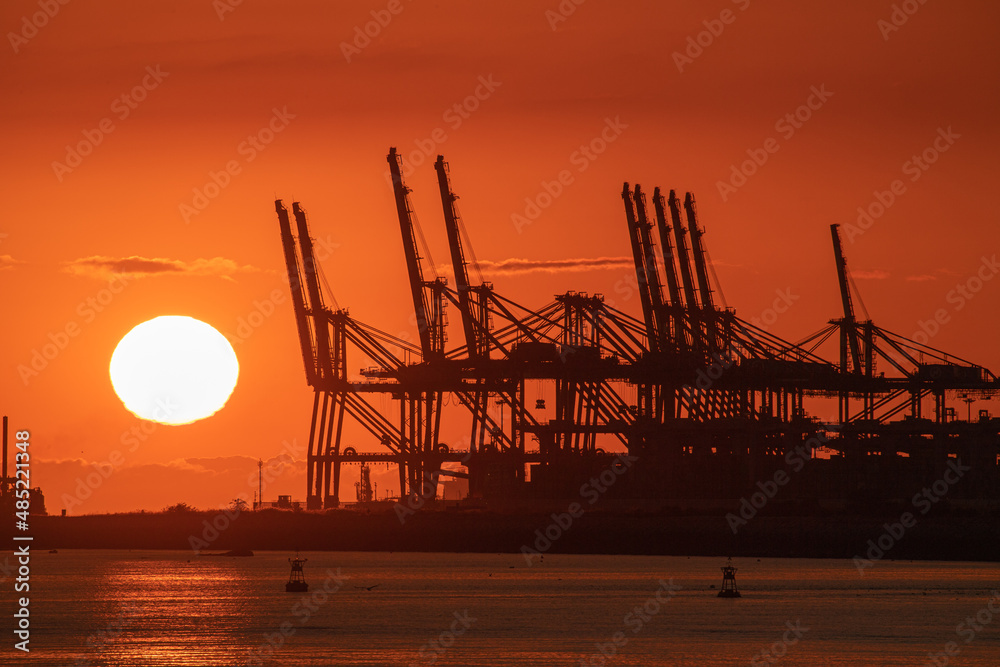 sunset and container crane