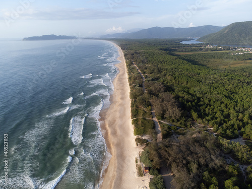 Incredible beach in the middle of nature, Atlantic forest. Praia do Moçambique, Rio Vermelho, Florianópolis, Santa Catarina, Brazil - drone view, top view photo