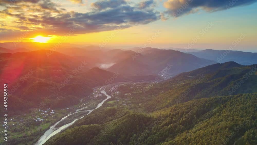 Aerial Fly Over View. Filming an Epic Sunset Over Mountain Landscapes. Amazing Light of Nature, Cloudy Landscape, Sky and Colorful Sunset Clouds. Beautiful Landscape Background Concept. Aerial Fly Over View. Filming an Epic Sunset Over Mountain Landscapes. Amazing Light of Nature, Cloudy Landscape, Sky and Colorful Sunset Clouds. Beautiful Landscape Background Concept.