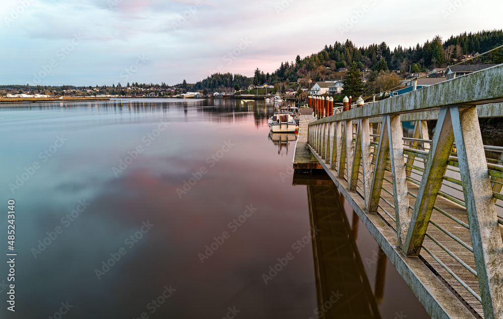 Boat dock at sundown on the Willapa River at South Bend in Washington, USA