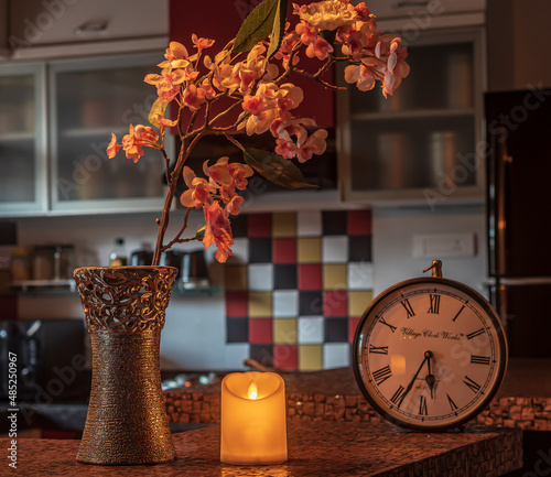 Flower in Vase Agaisnt with led candle in kitchen  photo