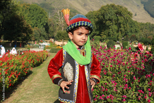 A boy wearing a ethnic dress of Kashmiris in India photo