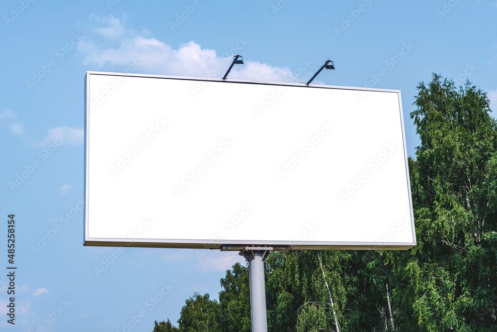 Blank billboard mockup with white screen. Against the backdrop of nature and blue sky. Business concept. Copy space banner for advertising. Blank billboard mockup with white screen. Against the backdrop of nature and blue sky. Business concept. Copy space banner for advertising.