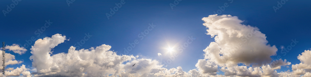 Blue sky panorama with puffy Cumulus clouds. Seamless hdr pano in spherical equirectangular format. Sky dome or zenith for 3D visualization, game and sky replacement for aerial drone 360 panoramas.