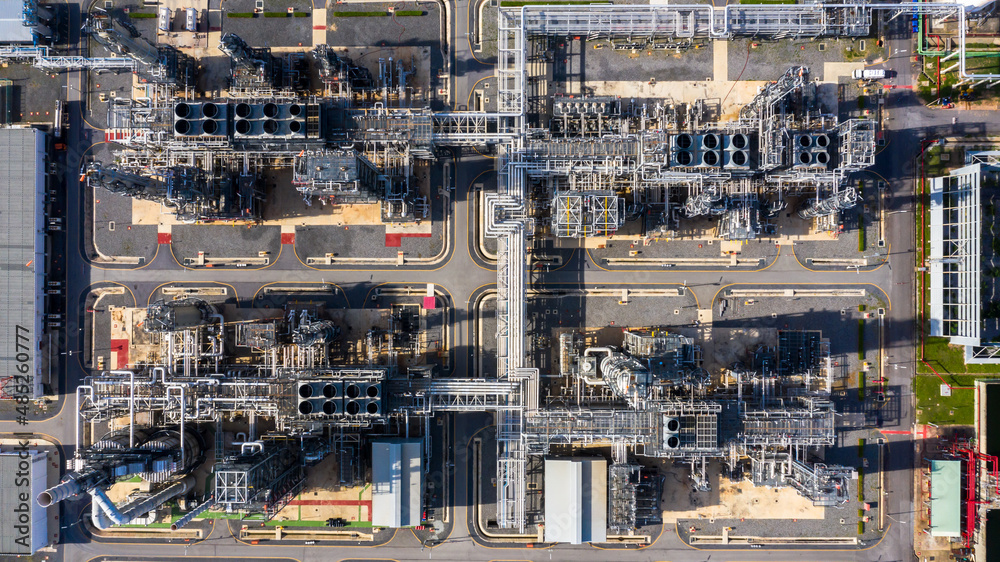 Oil refinery plant at industrial zone, Aerial view oil and gas business petrochemical industrial, Oil refinery factory white oil storage tank and pipeline steel, Ecosystem and healthy environment.