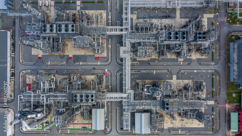 Oil refinery plant at industrial zone, Aerial view oil and gas business petrochemical industrial, Oil refinery factory white oil storage tank and pipeline steel, Ecosystem and healthy environment. © Kalyakan