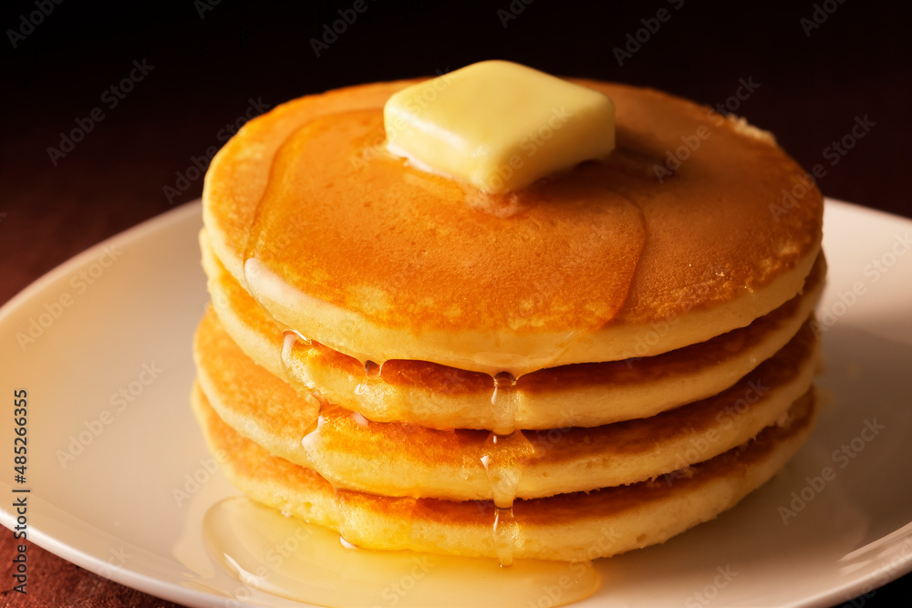Fototapeta premium パンケーキにハチミツをかける Pancakes with honey