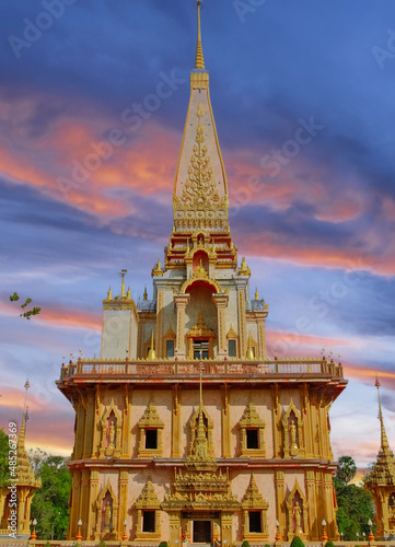 beautiful Wat Chalong Buddhist temples in Phuket Thailand. Decorated in beautiful ornate colours of red and Gold and Blue. Lovely sunset