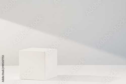 Gypsum cube on a white background. Product podium