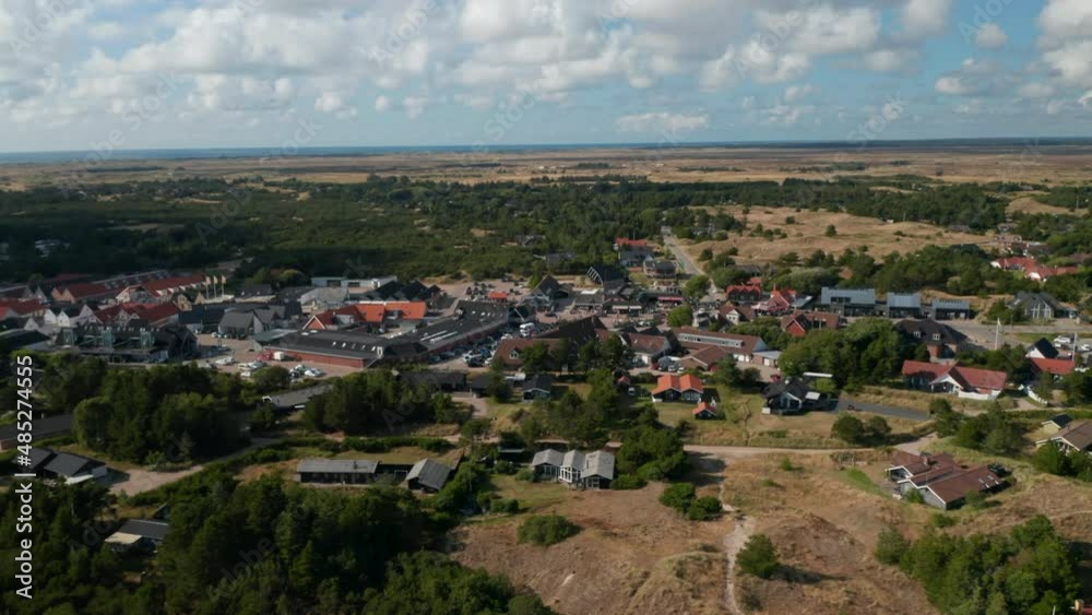 Slide and pan shot of centre of small town. Oksby and flat landscape from height. Summer vacation destination. Denmark Slide and pan shot of centre of small town. Oksby and flat landscape from height. Summer vacation destination. Denmark