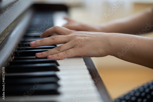 Close-up view of the piano keyboard while playing it.