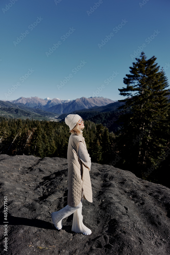 Stylish woman fashion clothes mountains nature sunny day landscape Stylish woman fashion clothes mountains nature sunny day landscape