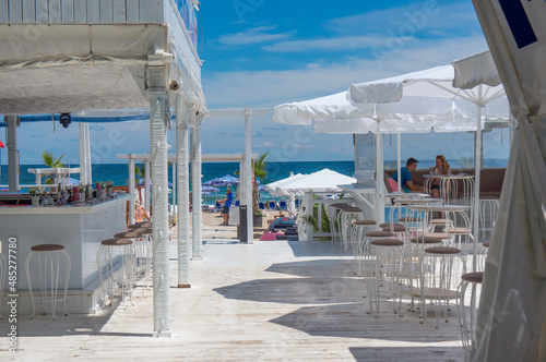 Beach bar on a white wooden terrace. Beach near Sozopol. Bulgaria © Vitaly