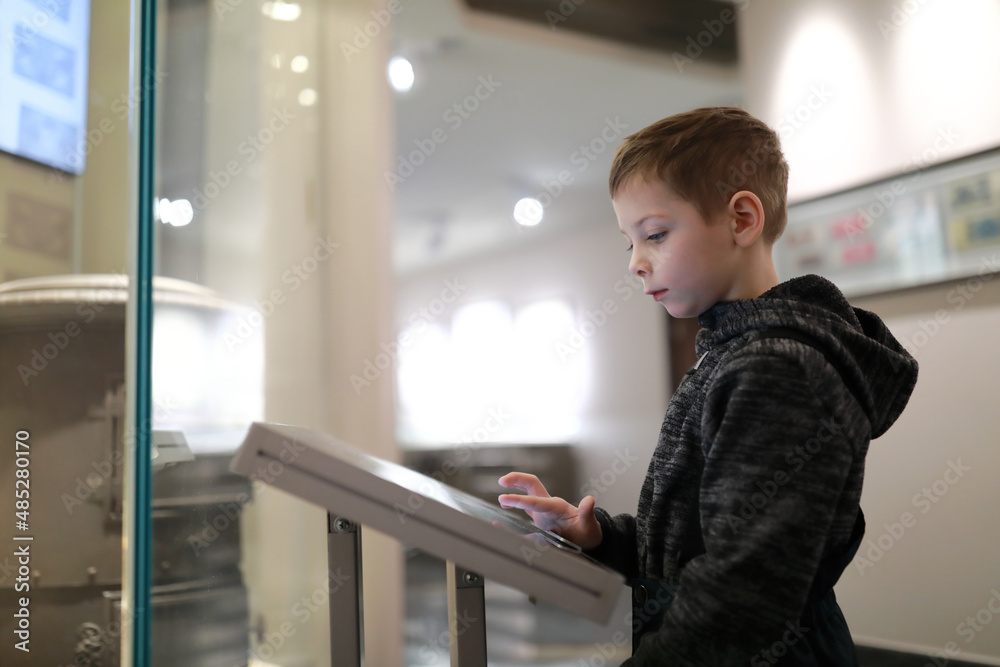 Boy using touch screen in Entertainment Center