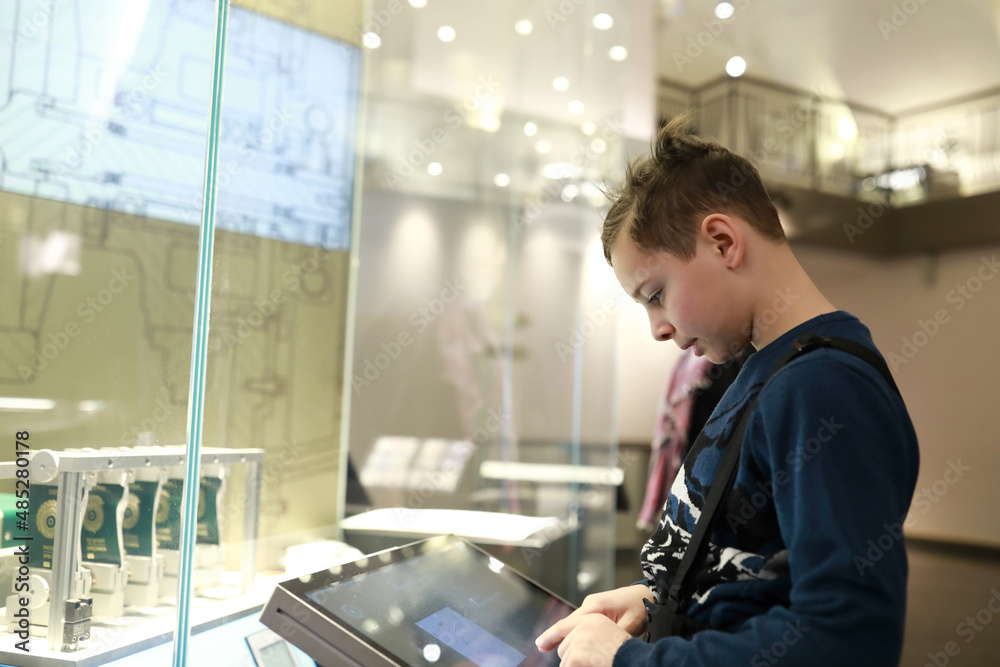 Child playing with touch screen in Entertainment Center Child playing with touch screen in Entertainment Center