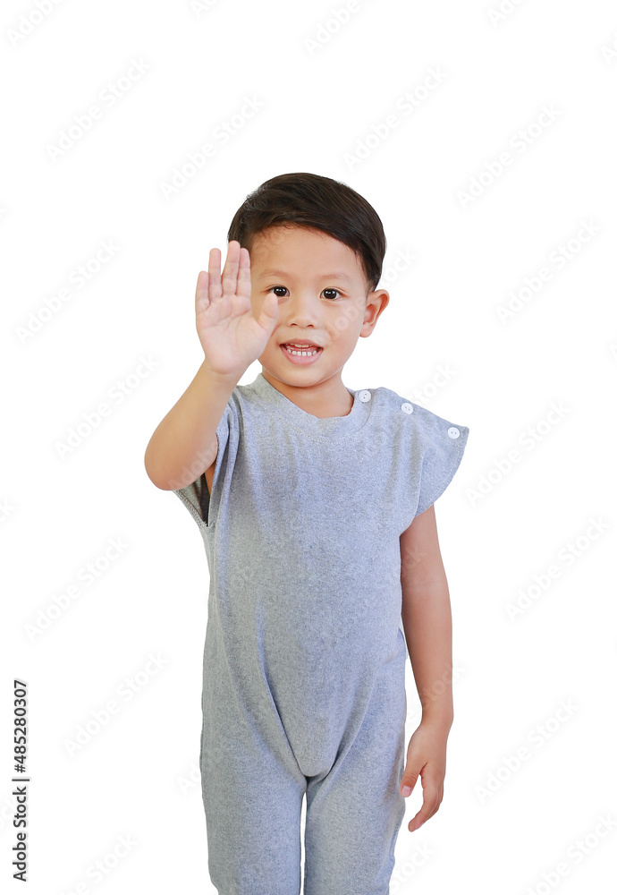 Portrait of Asian little boy show stop sign gesture isolated on white background. Child showing palm of hand, selective focus at his face Portrait of Asian little boy show stop sign gesture isolated on white background. Child showing palm of hand, selective focus at his face