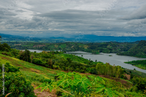 Natural background of the atmosphere in the garden house, surrounded by rice fields, plants, rice fields, reservoirs, and there is a seat to relax and watch the wind blowing through the cool blur.