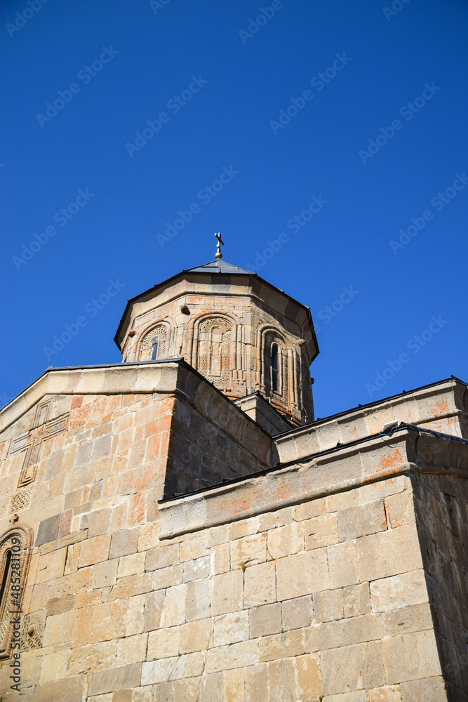 Fototapeta premium Gergeti Trinity Church in autumn in Gerogia Europe