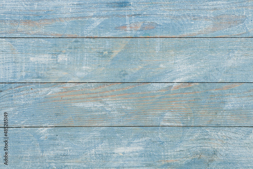 Vintage colored wood background texture with knots and nail holes. Old painted wood wall. Brown abstract background. Vintage wooden dark horizontal boards. Front view with copy space