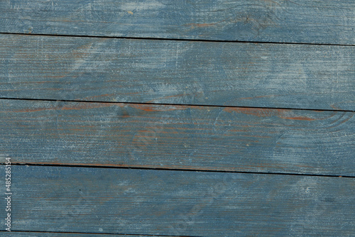 Vintage colored wood background texture with knots and nail holes. Old painted wood wall. Brown abstract background. Vintage wooden dark horizontal boards. Front view with copy space