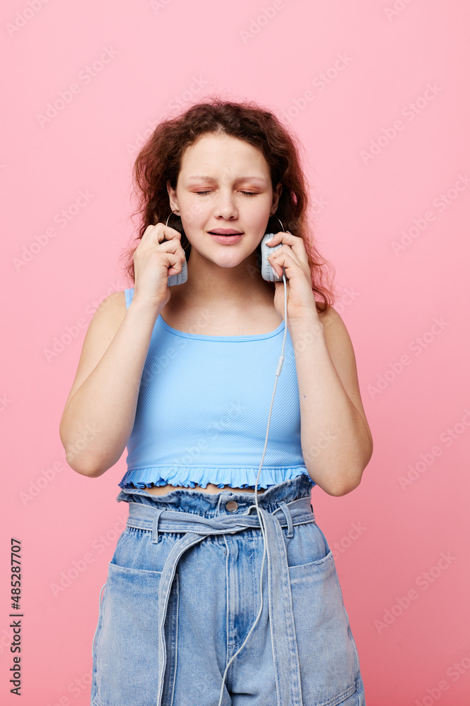 cute girl wearing headphones stylish youth clothing pink background cute girl wearing headphones stylish youth clothing pink background