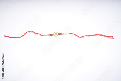 Raksha Bandhan, Indian festival with beautiful Rakhi on white background.