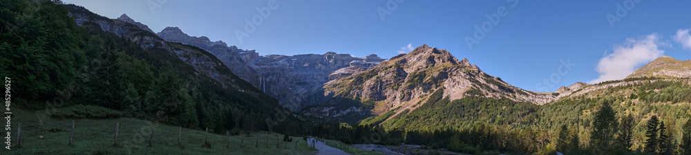 Panoramic view of the Cirque de Gavarnie with the first rays of the sun, Monte Perdido massif. France, Occitanie, Hautes Pyrenees