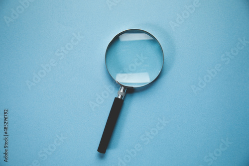 magnifying glass on the blue background