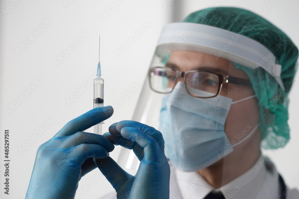 Professional medical doctor in hospital office. Portrait of young and confident physician. Medical concept. Professional medical doctor in hospital office. Portrait of young and confident physician. Medical concept.