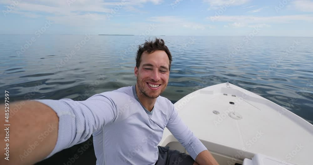 Man on boat taking selfie video sailing Man on boat taking selfie video sailing