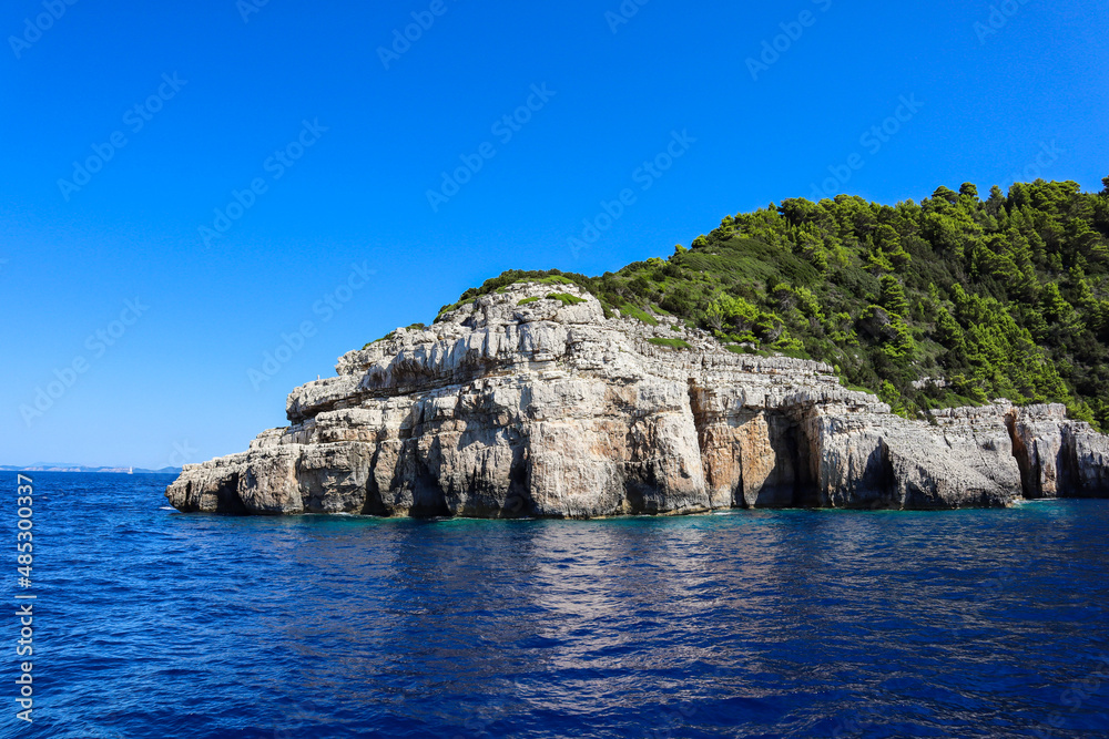 Ionian Sea, Rock and Blue Sky during Sunny Day in Paxos Island. Summer Scenery of Greek Landscape.