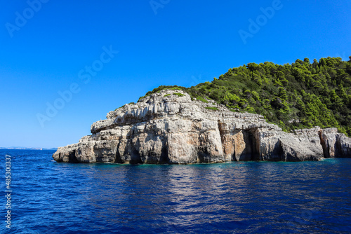 Ionian Sea, Rock and Blue Sky during Sunny Day in Paxos Island. Summer Scenery of Greek Landscape.