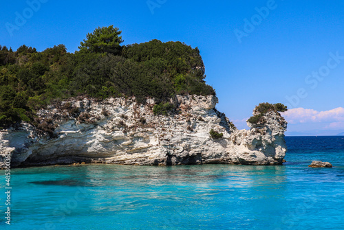 Rocky Stone in Turquoise Water with Blue Sky in Greece. Summer Day in Antipaxos with Ionian Sea.